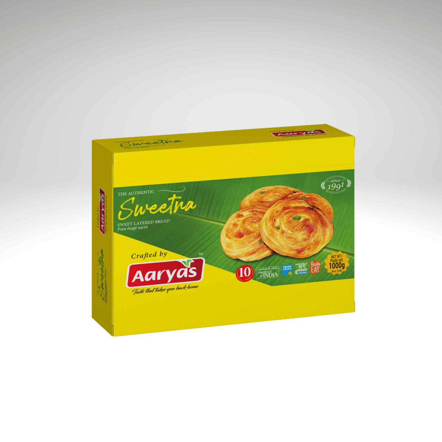 A yellow box of Aaryas Sweetna Sweet, featuring a green front panel with an image of golden-brown sweet bread and the Aaryas brand logo.