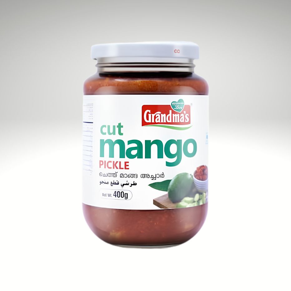 A jar of Grandma's Cut Mango Pickle with a white lid and a white label featuring green and red text, set against a light gray gradient background.
