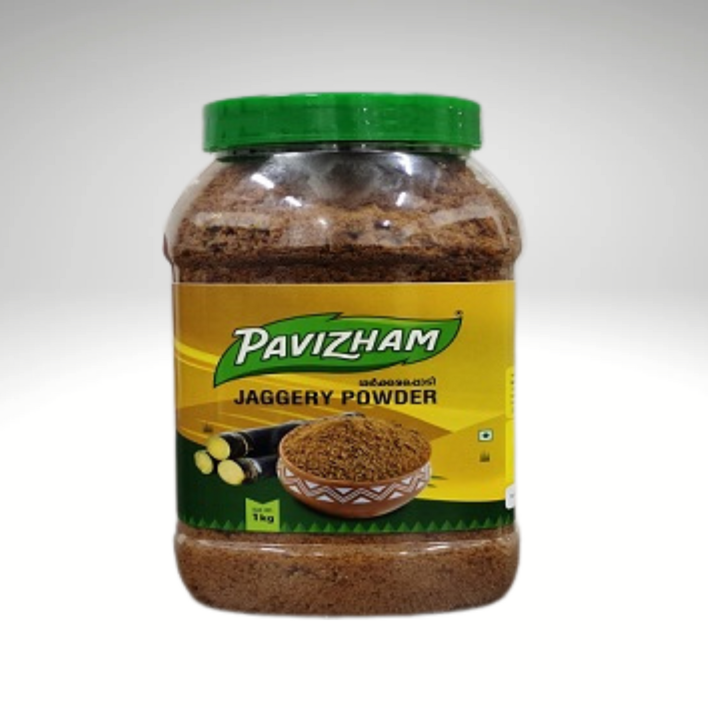 Jar of Pavizham jaggery powder with a green lid on a white background