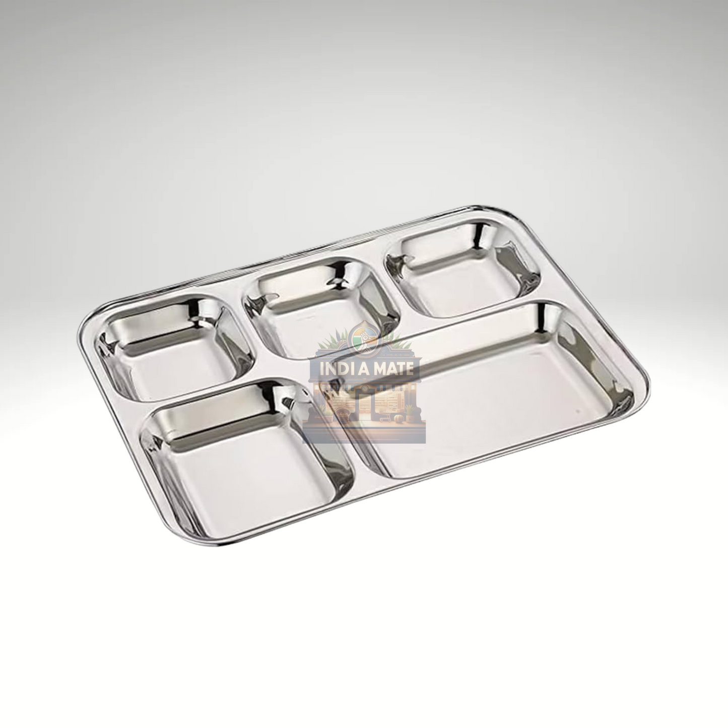 Stainless steel divided tray on a white background