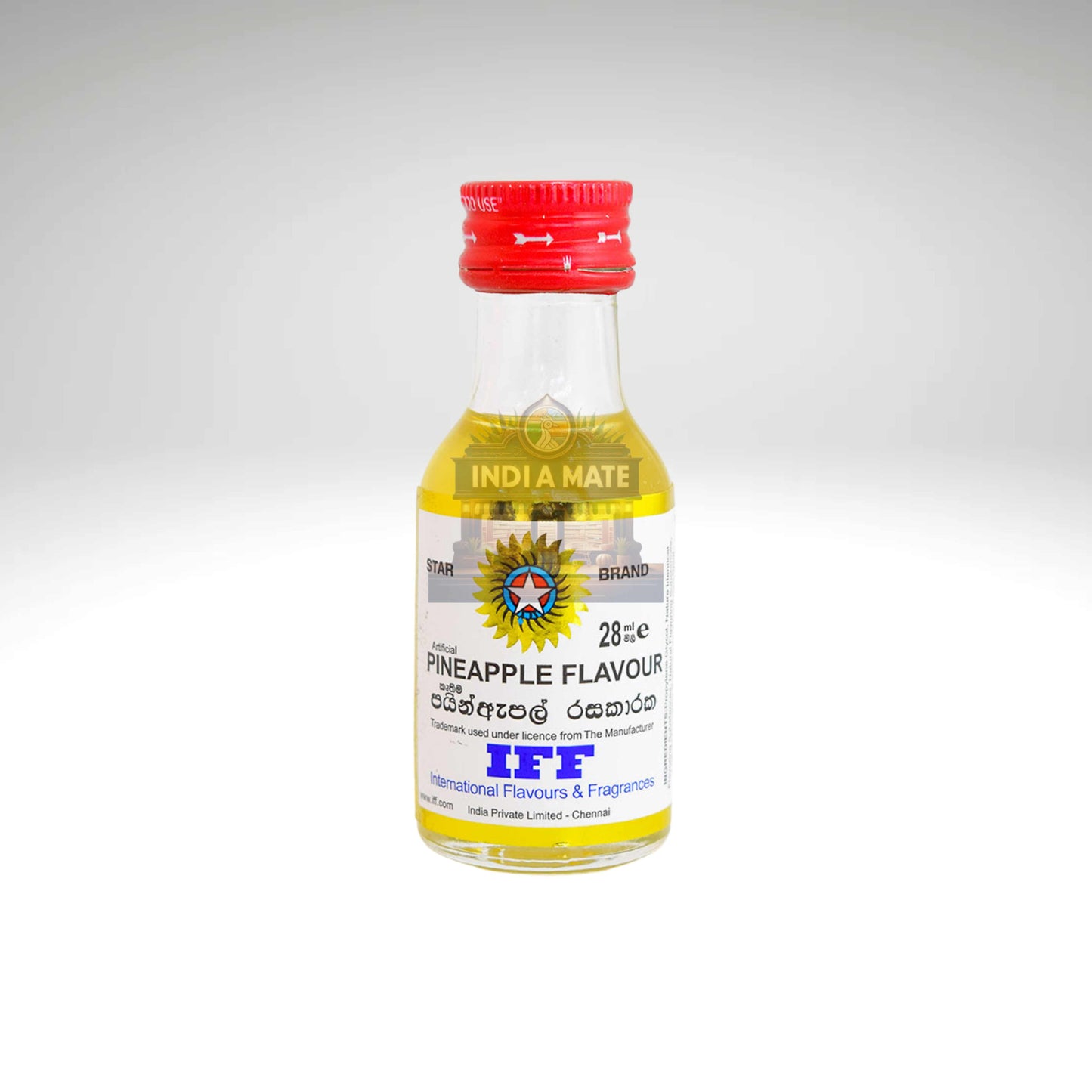 Small bottle with a red cap and yellow label on a white background