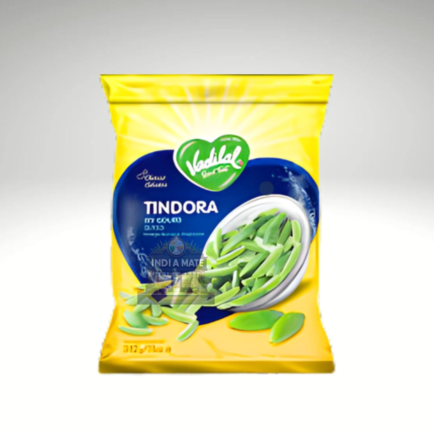 Yellow package of Tindora with green vegetables on a gray background