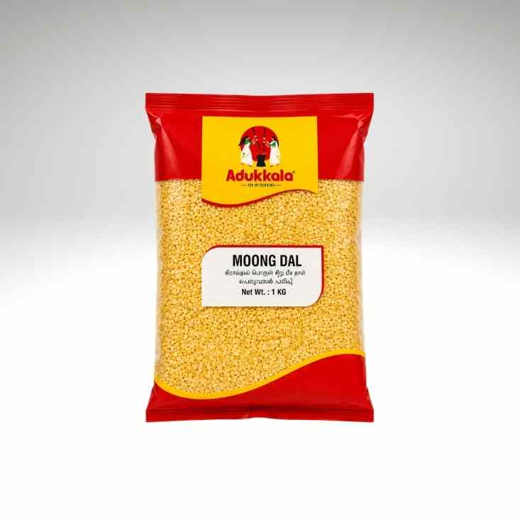 A 1 kg bag of Adukkala Moong Dal (split yellow lentils) against a neutral gray gradient background. The packaging is red with a yellow brand label and a white product label.