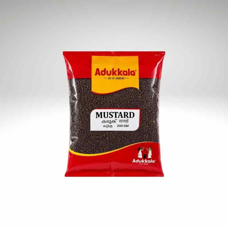 A 200g bag of Adukkala Mustard seeds, featuring a red and yellow packaging design with a clear window showing the dark brown mustard seeds inside, set against a light gray background.