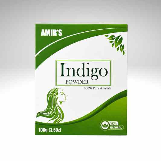 A 100g box of Amir's Indigo Powder, featuring a green and white design with a profile illustration of a woman with long green hair and leaf graphics.