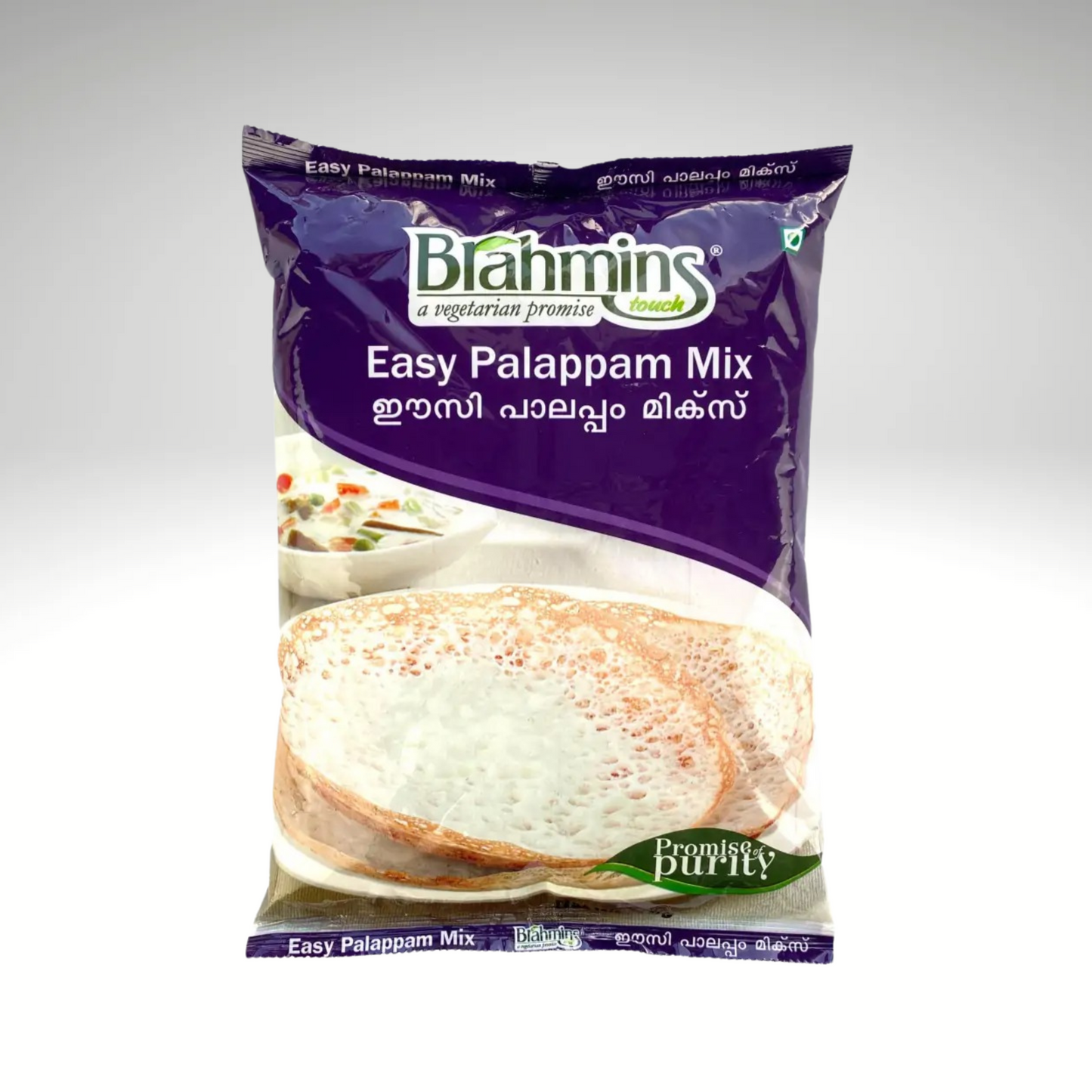 Image of a package of Brahmins Easy Palappam Mix, featuring a bright and colorful design. The package showcases the product name prominently, with a visual representation of soft, fluffy palappams served with a side of coconut milk or curry.