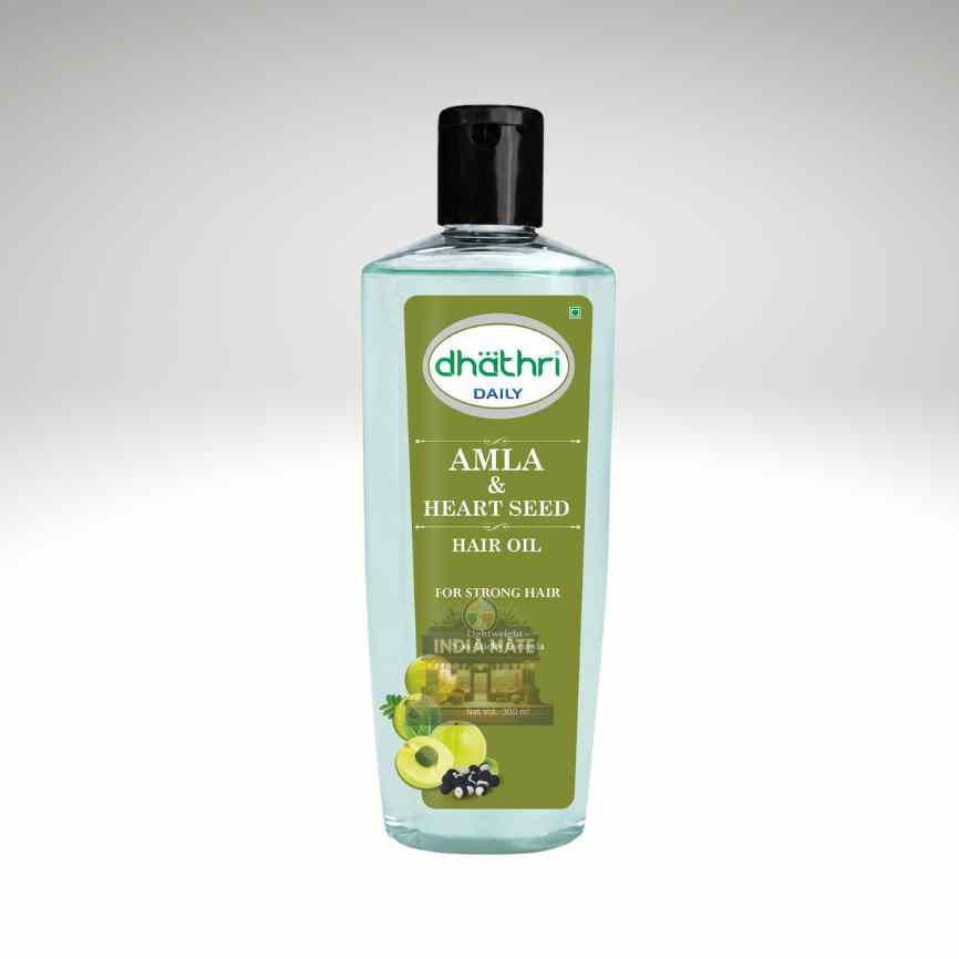 A bottle of Dhathri Daily Amla & Heart Seed Hair Oil, featuring a light green liquid inside a clear bottle with a black cap and a green label, set against a light gray gradient background.