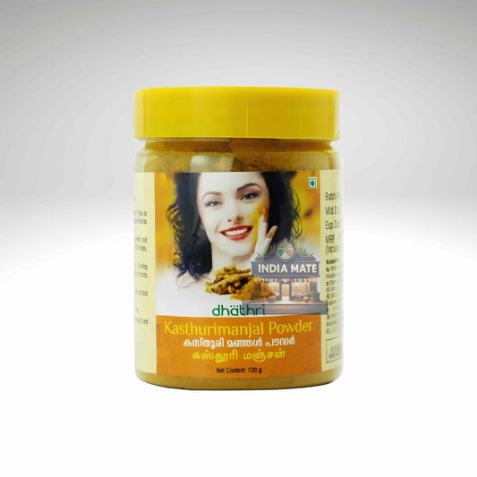 A jar of Dhathri Kasthurimanijal Powder (India Mate) with a bright yellow lid and a yellow label featuring a woman's face, set against a light gray gradient background.