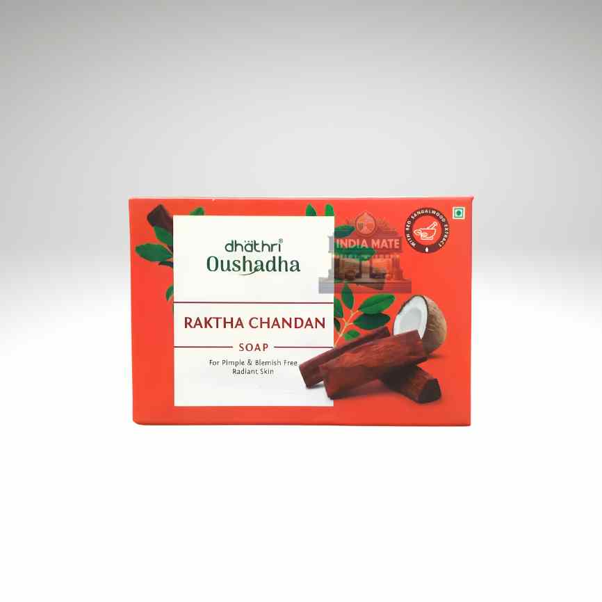 A rectangular red box of Dhatri Oushadha Raktha Chandan Soap, featuring white text panels and illustrations of cinnamon sticks and a coconut on a light gray gradient
background.