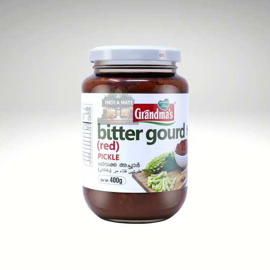Jar of Grandma’s Bitter gourd Pickle – Kerala-style Pavakka Achar made with sliced bitter gourd, spices, and garlic.