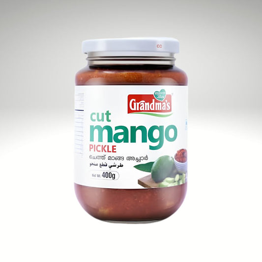 A jar of Grandma's Cut Mango Pickle with a white lid and a white label featuring green and red text, set against a light gray gradient background.