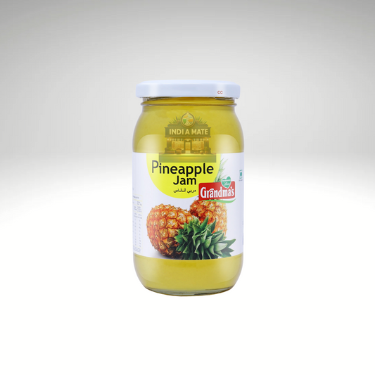 Glass jar of Grandma’s Pineapple Jam – golden yellow tropical fruit spread made with ripe pineapples.