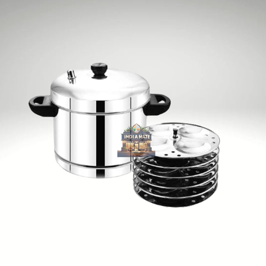 Madhu stainless steel idli cooker with six stacked circular plates and a locking rim, filled with freshly steamed idlis on a countertop.
