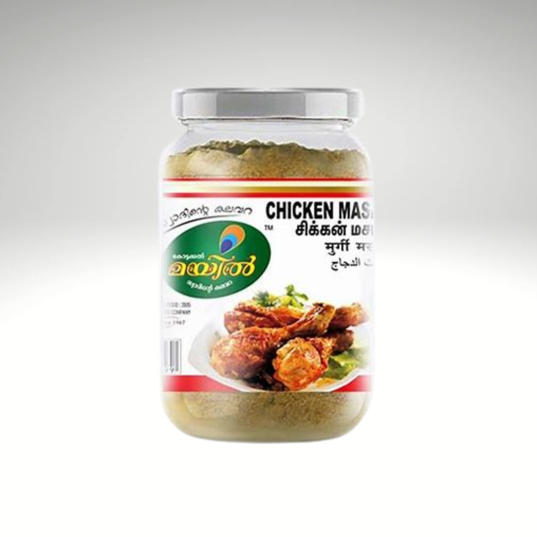 Mayil Chicken Masala, a spice mix specially crafted for marinating and cooking chicken, presented in a vibrant green and white packaging. The label features the Mayil brand logo and a detailed list of spices, making it ideal for preparing flavorful and aromatic chicken dishes.