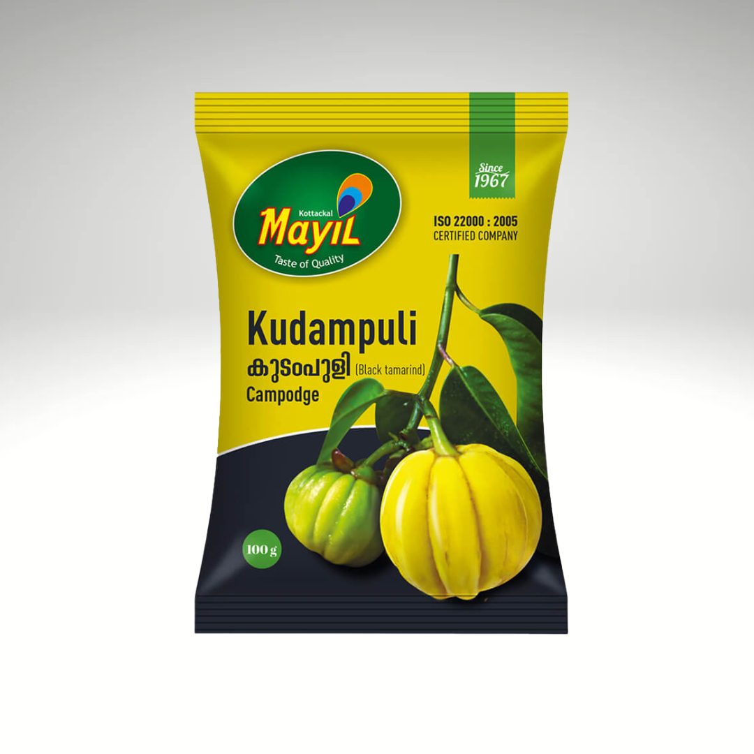 Mayil Kudampuli, a pack of dried kokum (Garcinia indica) fruit, used as a souring agent in South Indian cooking. The product is presented in a green and yellow packaging, prominently featuring the Mayil brand logo and information about its culinary uses, ideal for adding a tangy flavour to curries and rice dishes.