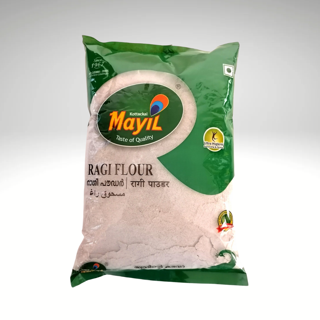 Mayil Ragi Flour, a pack of finely ground finger millet flour used in South Indian cooking for nutritious dishes. The product is in green and white packaging, featuring the Mayil brand logo and information about the ingredients, ideal for making rotis, dosas, and other healthy recipes.