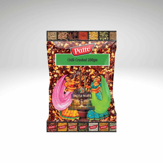Pattu chili crushed spice package with traditional Indian scene on a white background.