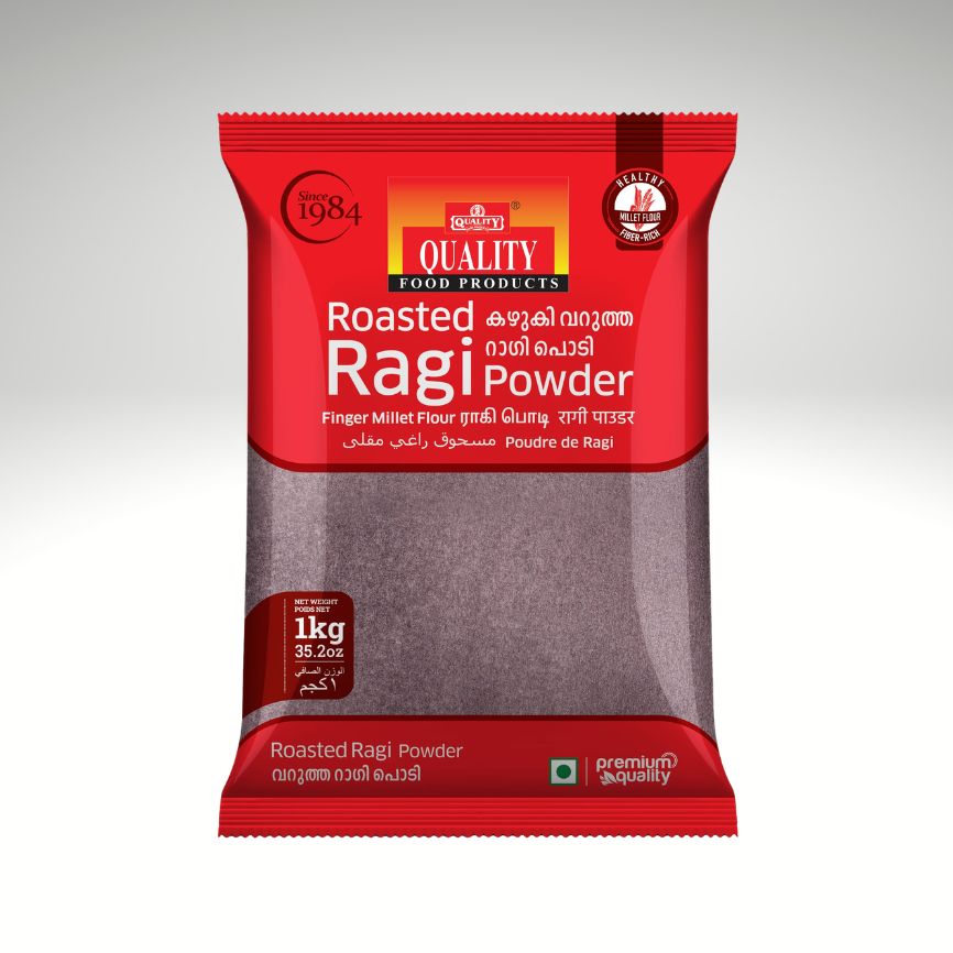 A 1 kg package of Quality Food Products Roasted Ragi Powder, featuring a red wrapper with a clear window showing the dark brown roasted finger millet flour inside.