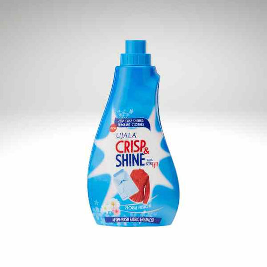 A bottle of Ujala Crisp & Shine fabric enhancer in a bright blue color, shown on a light gray gradient background.