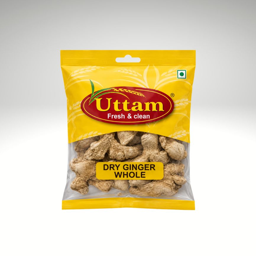 A package of Uttam brand Dry Ginger Whole, in a yellow bag with a clear window showing the dried ginger pieces inside, set against a neutral gray gradient background.