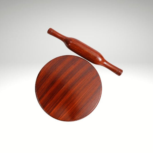Round wooden  chapathi rolling board with roller on a white background.